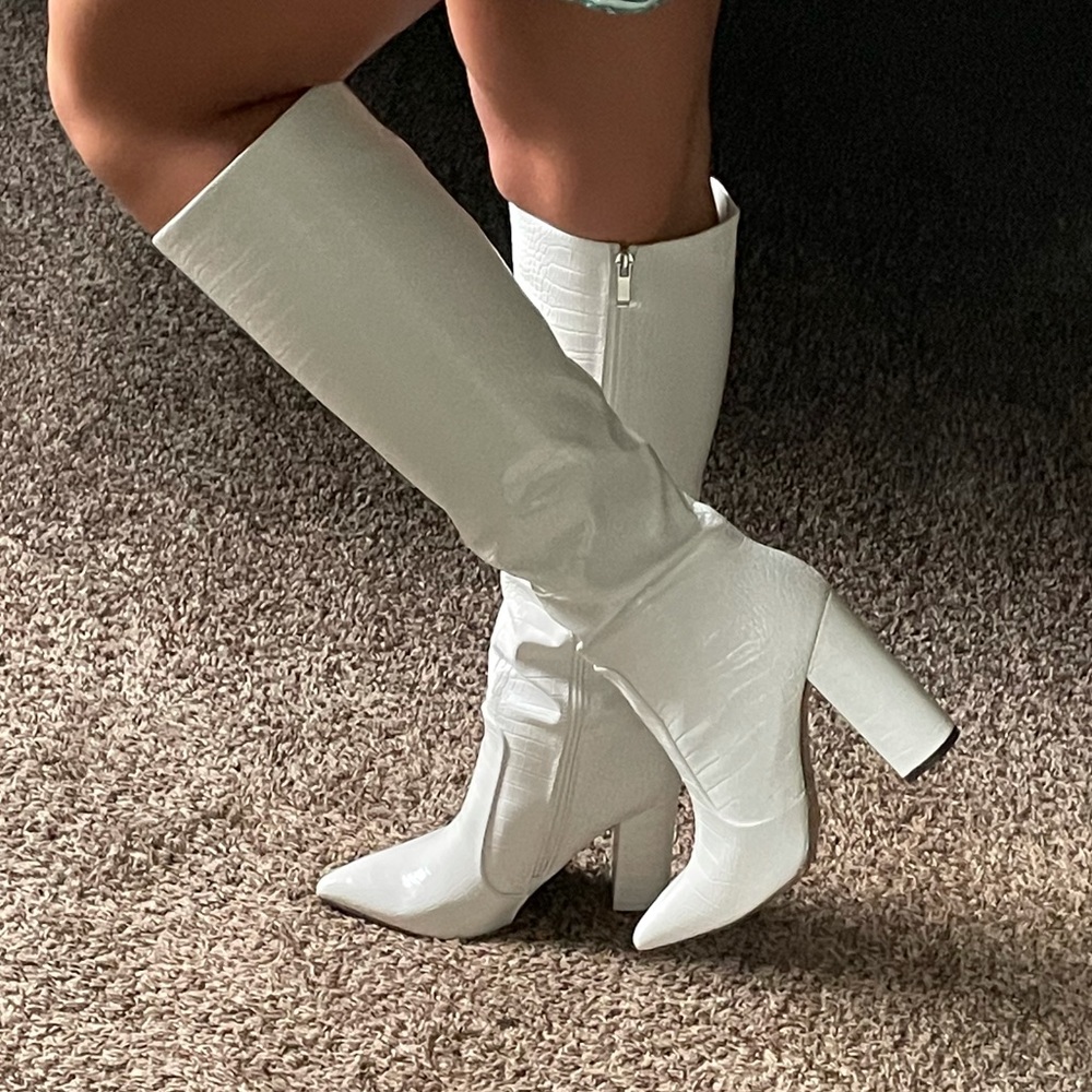 White knee-high snakeskin heeled boots